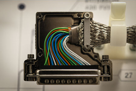 Aircraft wiring-harness connector with braided shielding and color-coded conductors